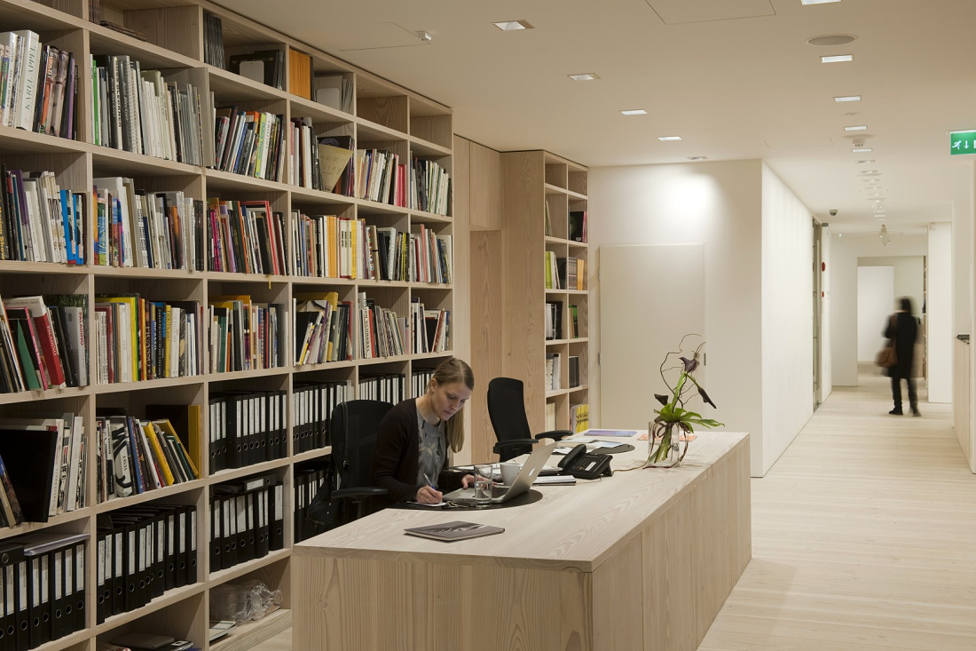 Forsblom Gallery office featuring ERCO LED lighting and a bookshelf.