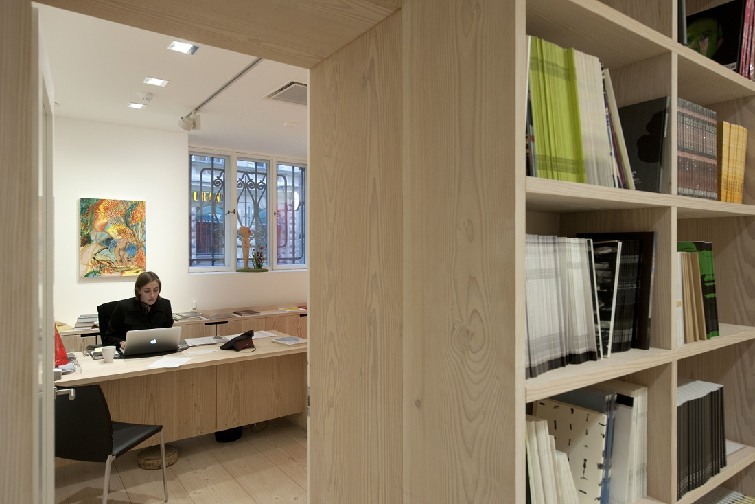 Forsblom Gallery office featuring ERCO LED lighting and a bookshelf.