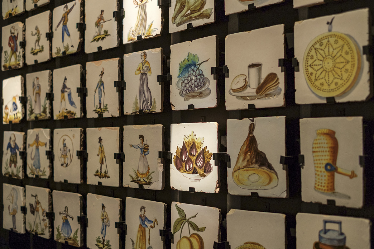 Close-up of artworks illuminated by ERCO spotlights in a gallery setting.