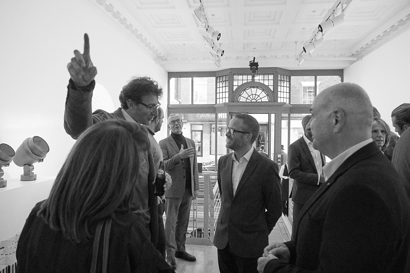 Attendees at the ERCO London showroom for the Frank Lloyd Wright film screening, spotlighting lighting.
