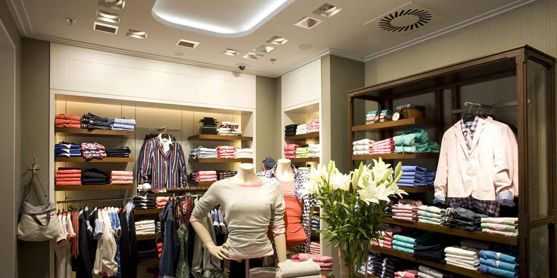 GANT flagship store in Prague illuminated by ERCO LED lighting, showcasing apparel.