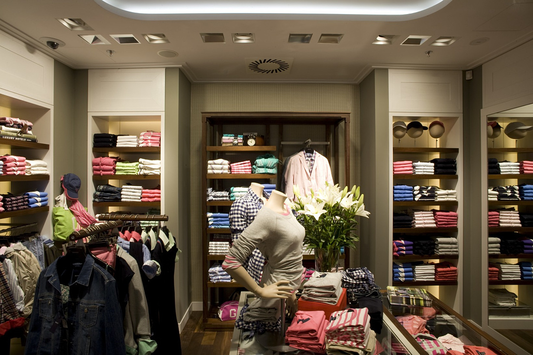 GANT flagship store in Prague illuminated by ERCO LED lighting, showcasing retail space.