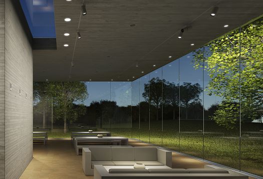 Interior space with ERCO lighting and nature view through glass walls.