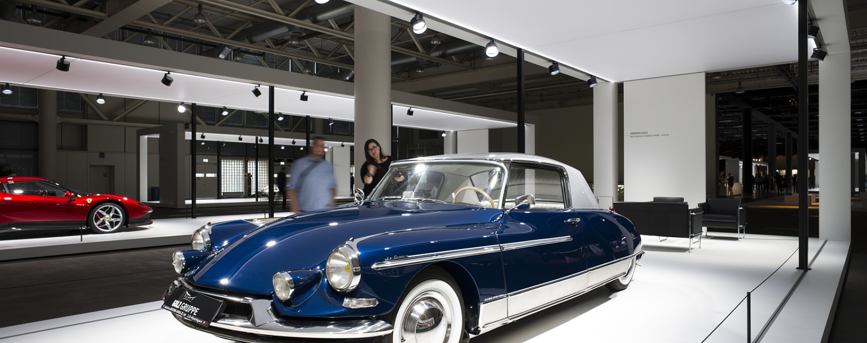 Blue Citroen DS classic car at Grand Basel show, illuminated by ERCO spotlights.