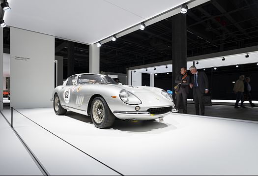 Silver vintage Ferrari at Grand Basel exhibition, illuminated by ERCO spotlights.