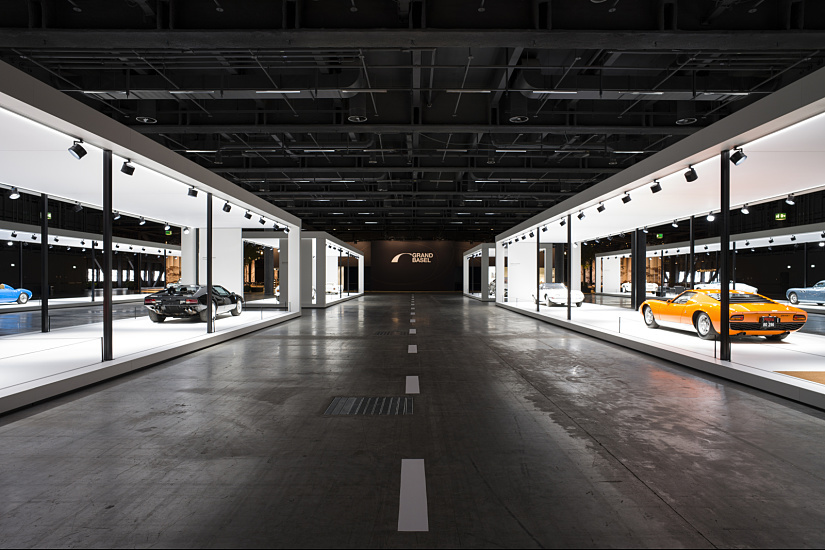 Grand Basel classic car exhibition featuring ERCO lighting for collector automobiles.