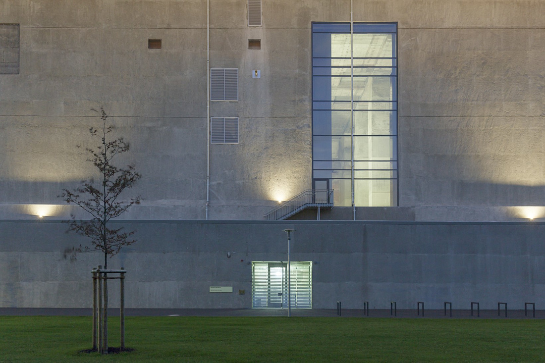 Illuminated facade of the Energy Bunker Hamburg, a landmark supplying renewable energy.