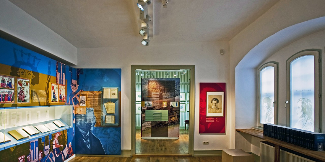 Interior of the Grimm Brothers’ House Museum featuring Optec LED spotlights illuminating exhibits.