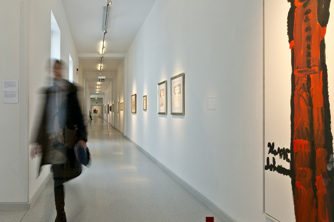 Gugging Museum hallway with Logotec spotlights accentuating art. Focused lighting.