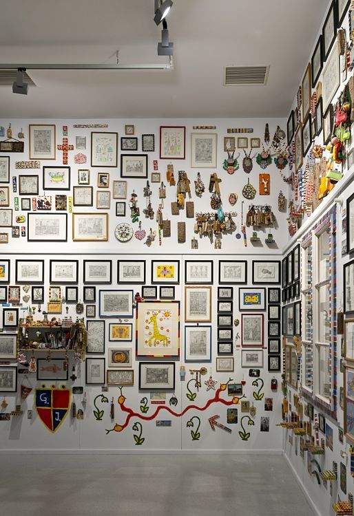 Gugging Museum wall installation featuring art brut, illuminated by ERCO Logotec spotlights for high contrast.