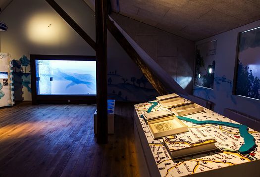 KM 51 – Erftmuseum exhibit with ERCO lighting guiding visitors through interactive installations in a historic watermill.