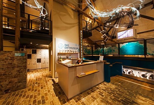 Reception area at KM 51 – Erftmuseum in Gymnicher Mühle, featuring ERCO lighting.
