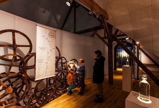 Gymnicher Mühle Museum: Interactive exhibit with ERCO lighting showcasing river history.