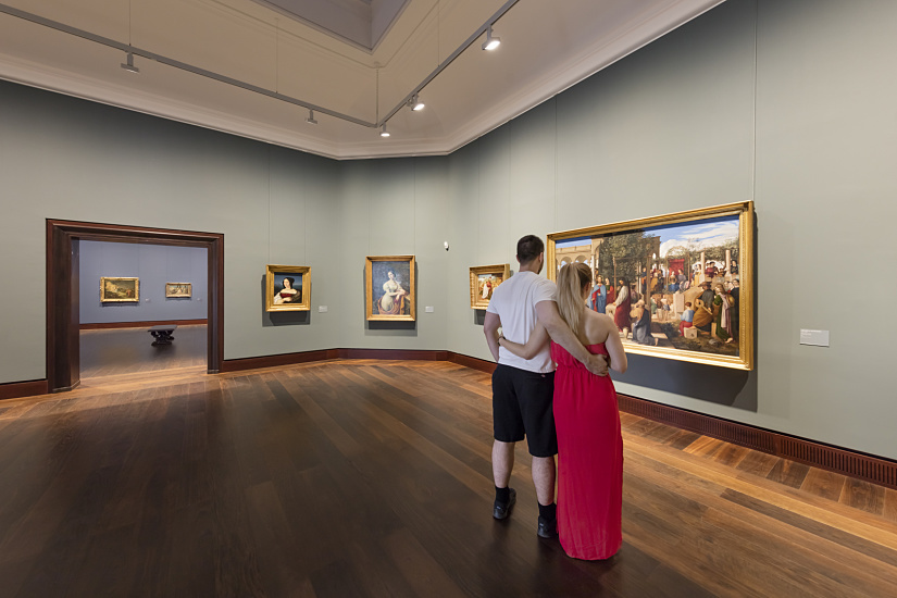 Visitors admire paintings at Hamburger Kunsthalle, illuminated by ERCO LED spotlights.