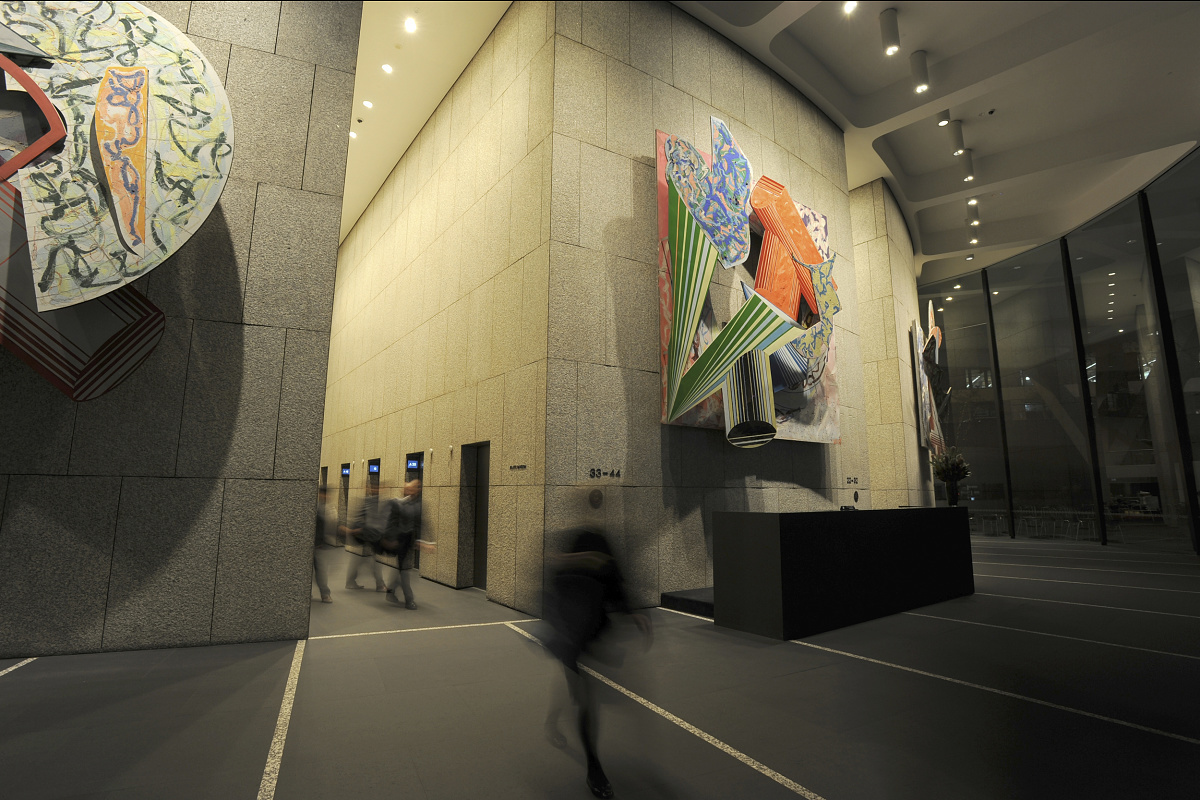 MLC Center lobby featuring art and ERCO wallwashing for high ceilings.