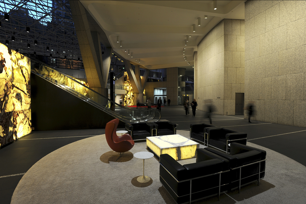 MLC Center lobby in Sydney featuring ERCO wallwashing and LED downlights for high ceilings.