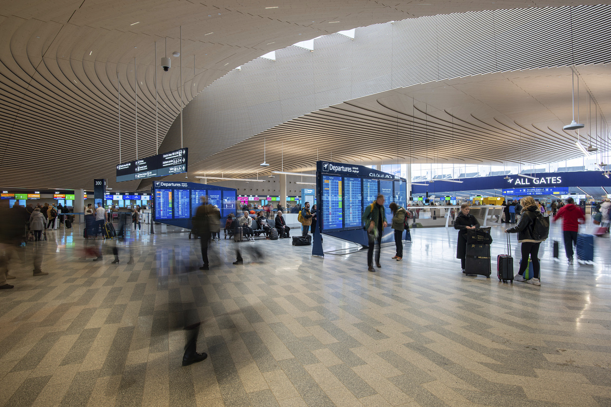 High lumen-output LED lighting integrated into the ceiling of Helsinki Airport.