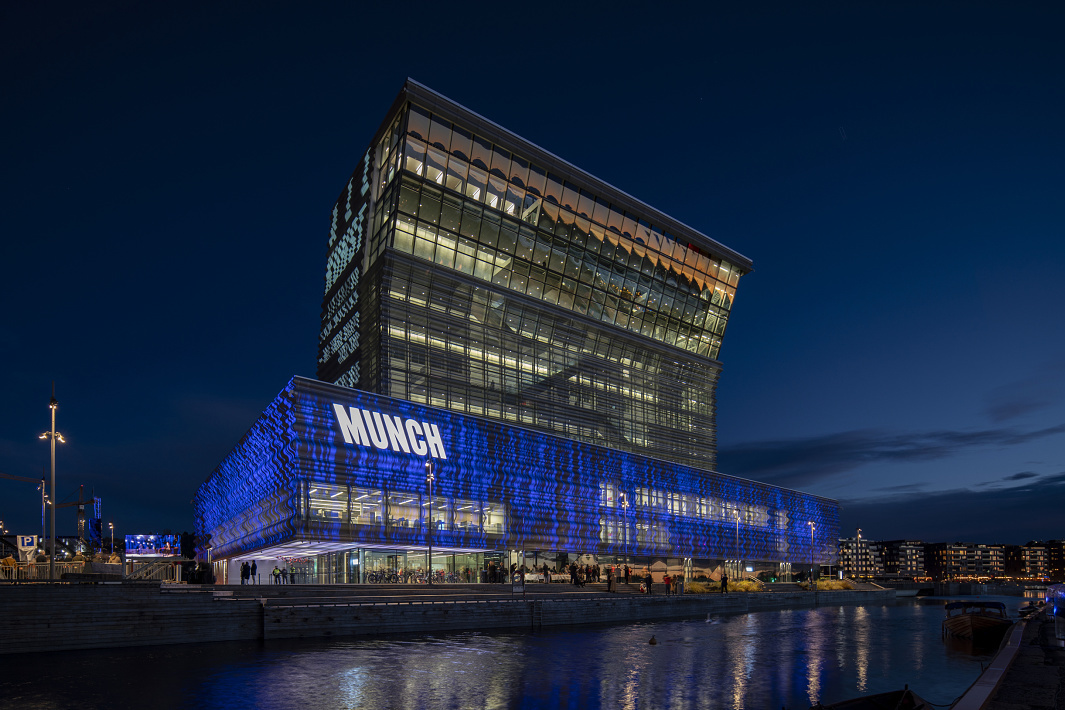 The Munch Museum in Oslo, illuminated by ERCO LED spotlights, showcasing the art collection at night.