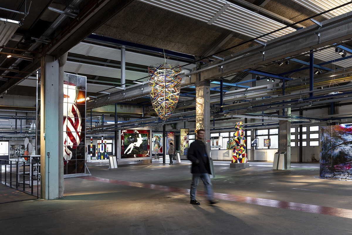 Holmegaard Værk glass museum in Denmark, showcasing glass art with customized ERCO LED lighting in historic architecture.