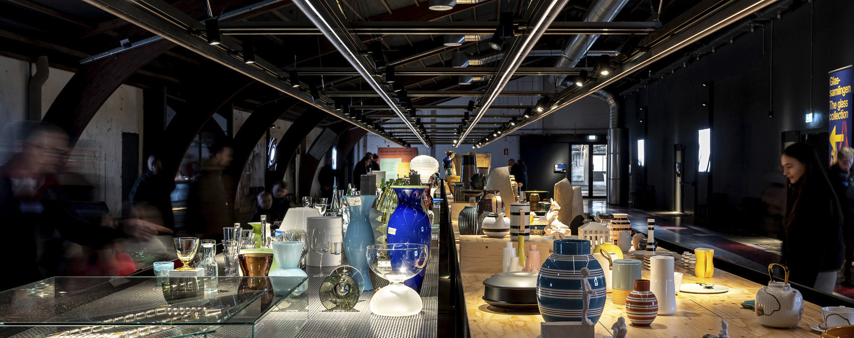 Holmegaard Værk glass museum: Glass art on display, illuminated by ERCO LED spotlights in Denmark.