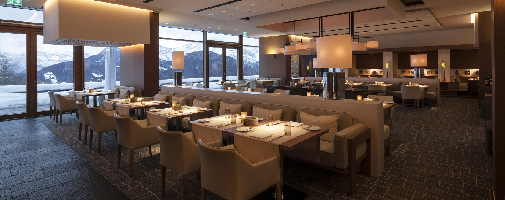 Elegant restaurant with ERCO lighting creating an inviting atmosphere.