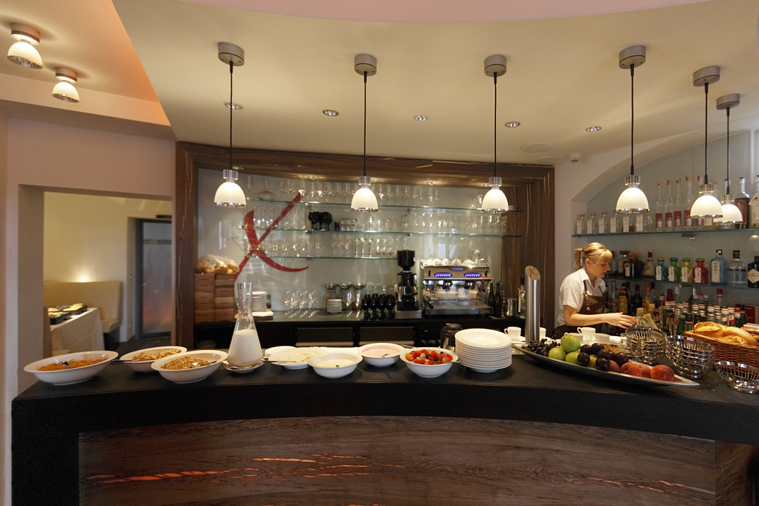 Hotel Nixe restaurant featuring Starpoint downlights and Optec spotlights for ambient lighting.