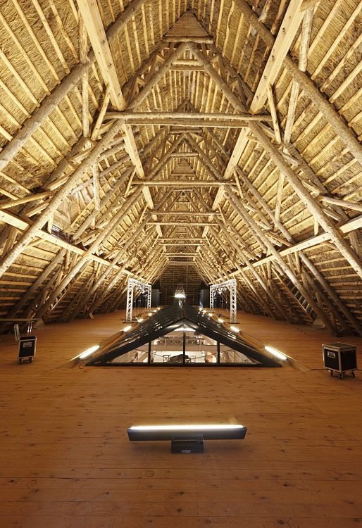 Wooden roof structure with ERCO lighting at Weissenhaus Grand Village Resort & Spa.