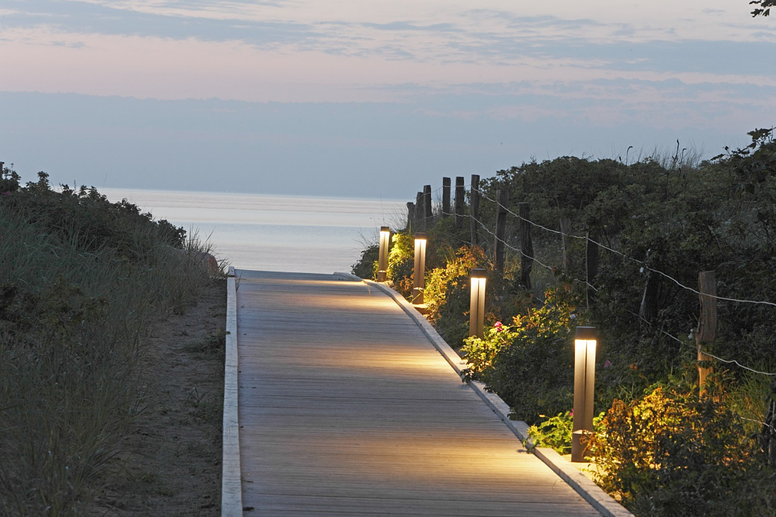 ERCO Focalflood façade luminaires illuminate the path to the beach at Weissenhaus Grand Village Resort & Spa.