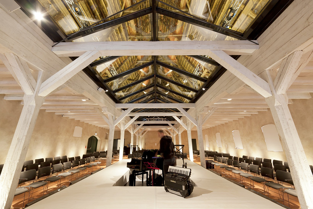 Hotel Weissenhaus interior featuring ERCO lighting and historic architecture.