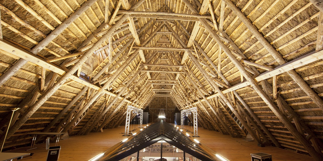 Wooden beam structure at Weissenhaus Grand Village Resort & Spa, featuring ERCO lighting.