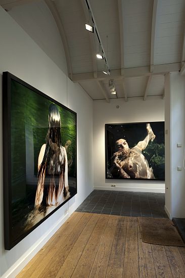 ERCO LED lighting illuminates photo exhibits in restored rooms at Huis Marseille Museum, Amsterdam.