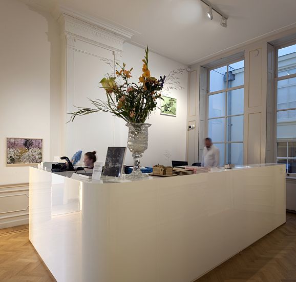 Reception area at Huis Marseille museum, Amsterdam, illuminated by ERCO LED lighting.