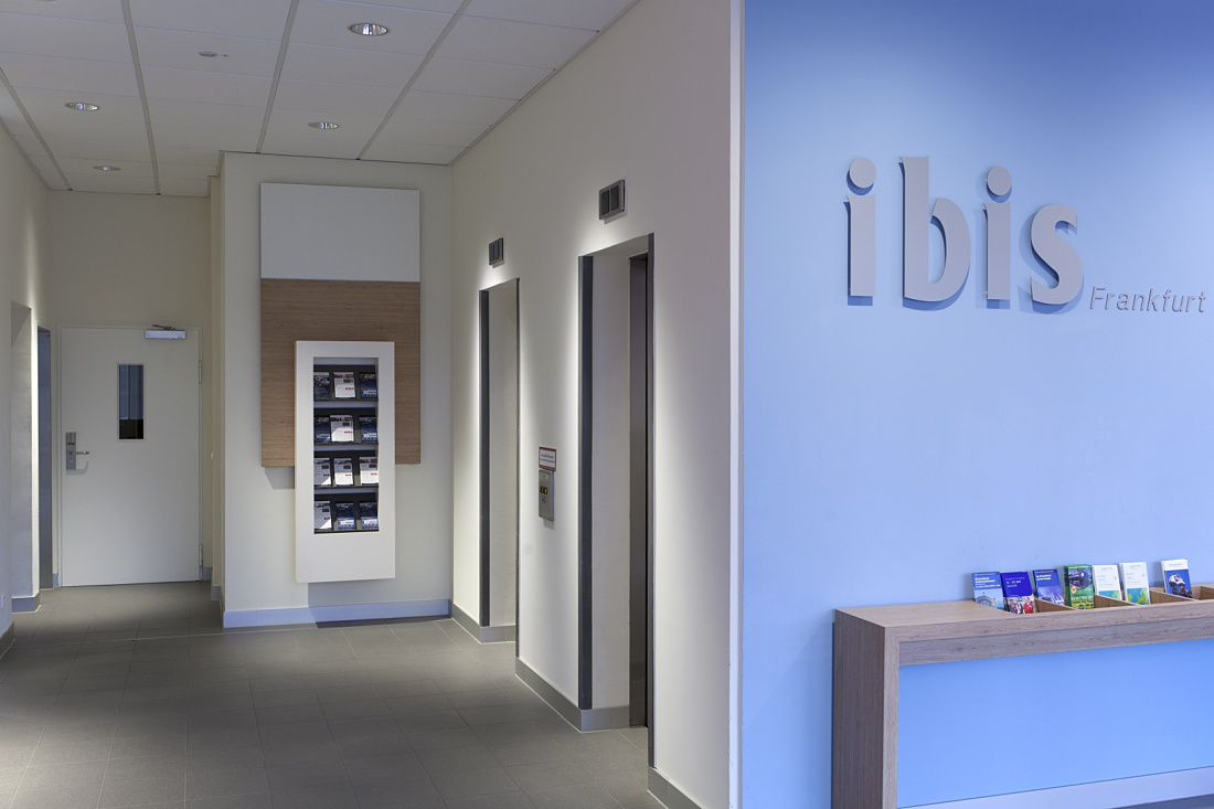 Ibis Hotel Frankfurt hallway featuring LED lighting and elevators.