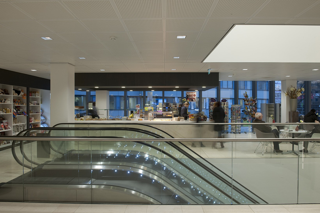 Ikazia Hospitals entrance area featuring Quintessence LED lighting and an escalator.
