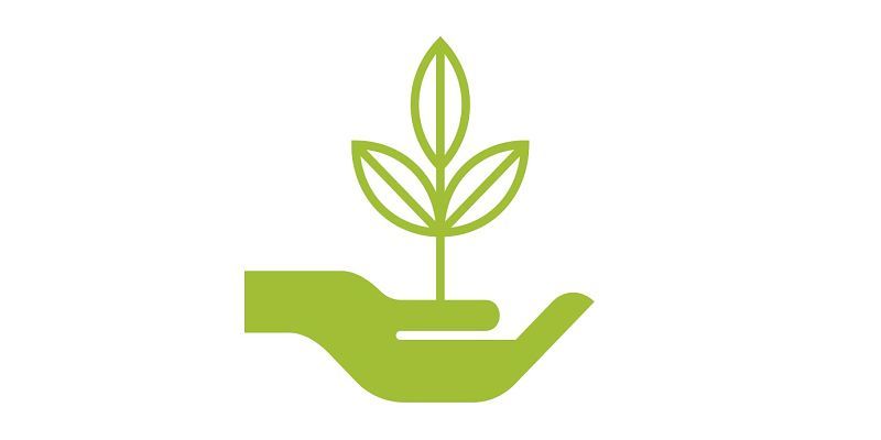 Green hand holding plant: ERCO Greenology for sustainable lighting.
