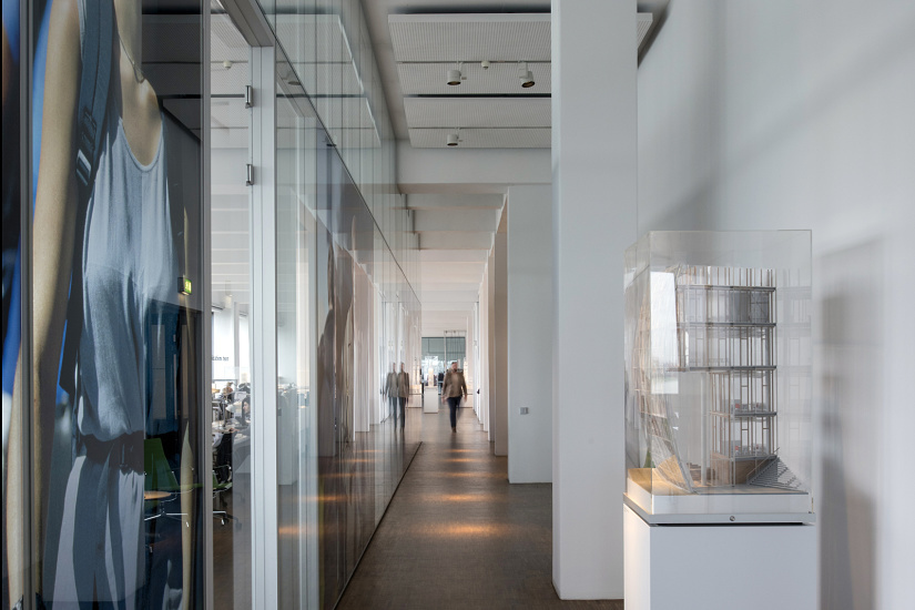 Ingenhoven Architects office hallway featuring Optec spotlights on track for flexible lighting.