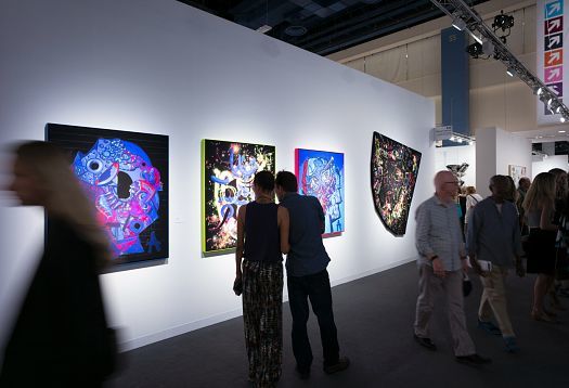 Art Basel Miami Beach illuminated by ERCO LED lighting, showcasing art in gallery booths.