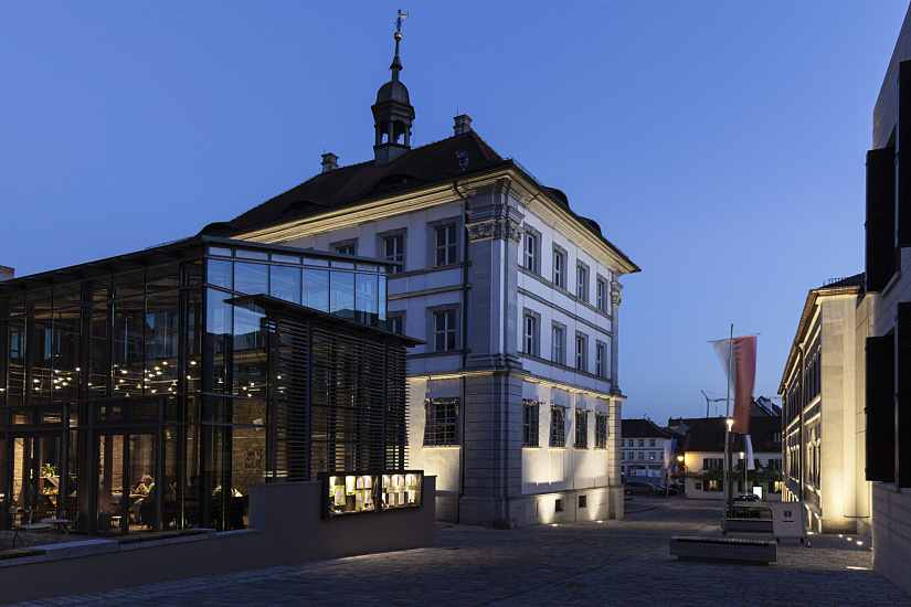 Illuminated Iphofen Service Centre: ERCO LED lighting accentuates historic and modern architecture.
