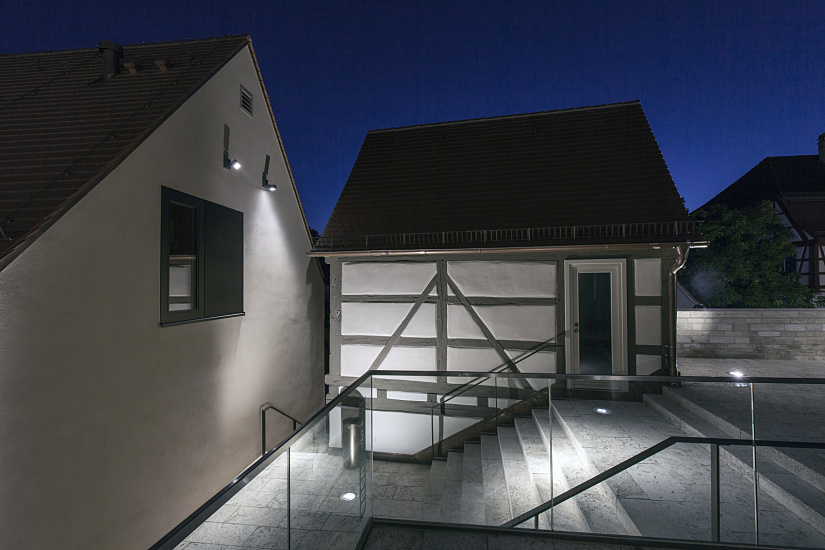 ERCO LED lighting highlights architecture in Iphofen, accentuating historic facades and modern elements.