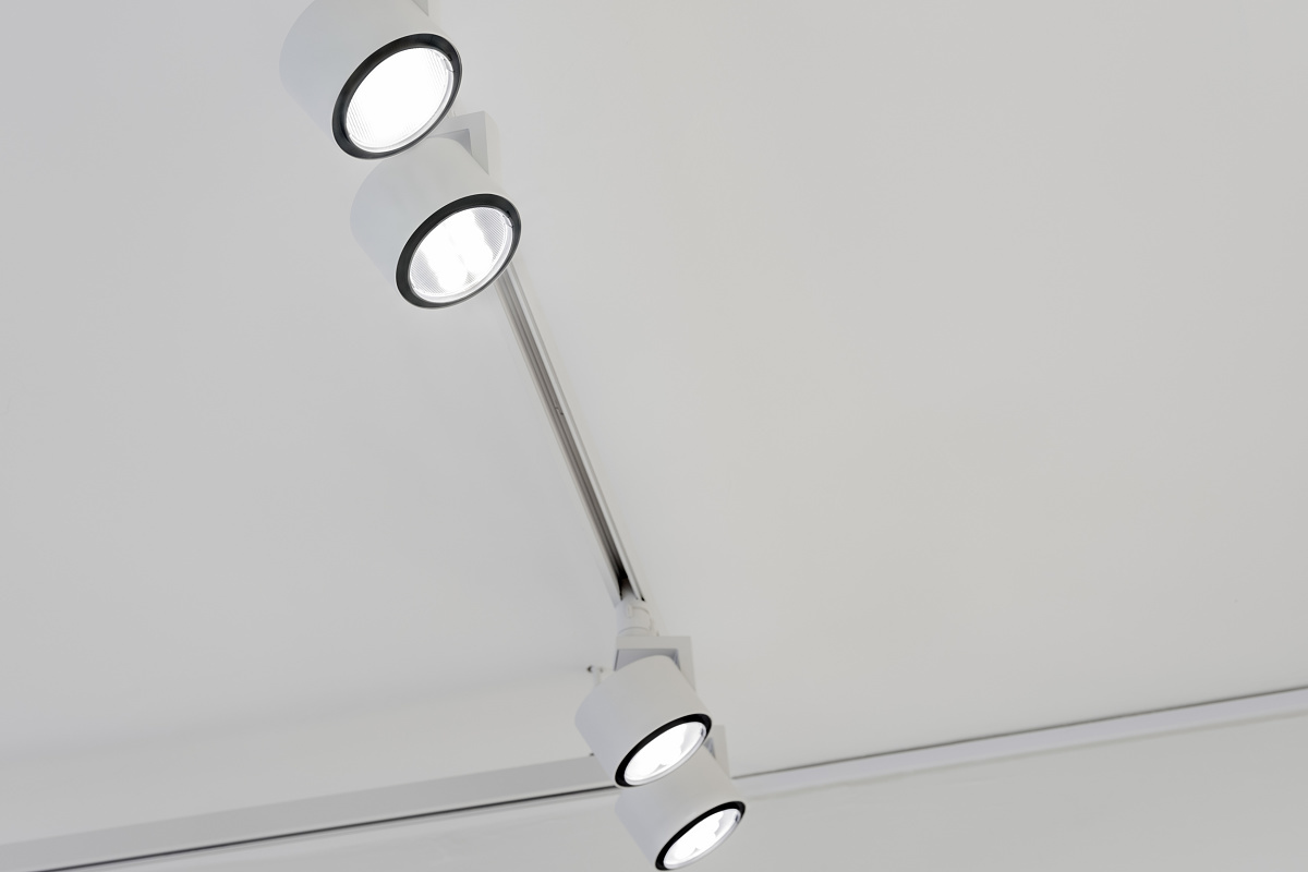 ERCO Parscan spotlights on a track, providing accent lighting in the Johyun Gallery.