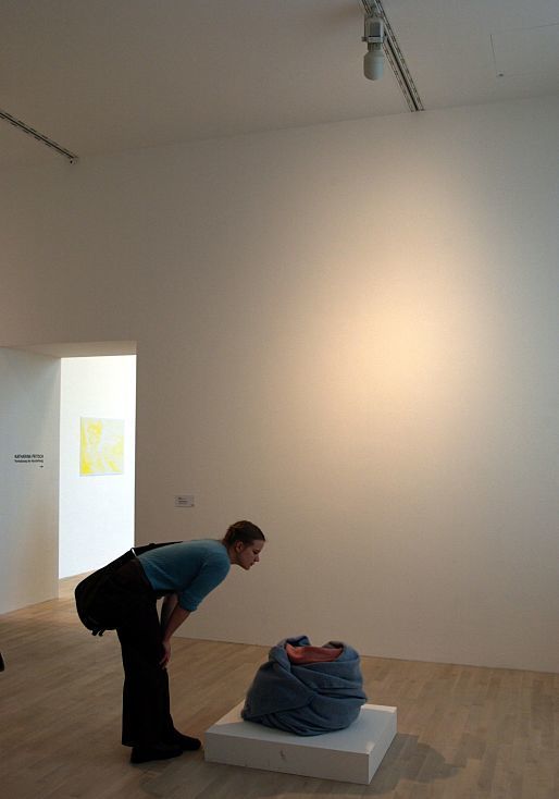 Visitor views art under ERCO lighting at K21 Art Gallery in Düsseldorf.