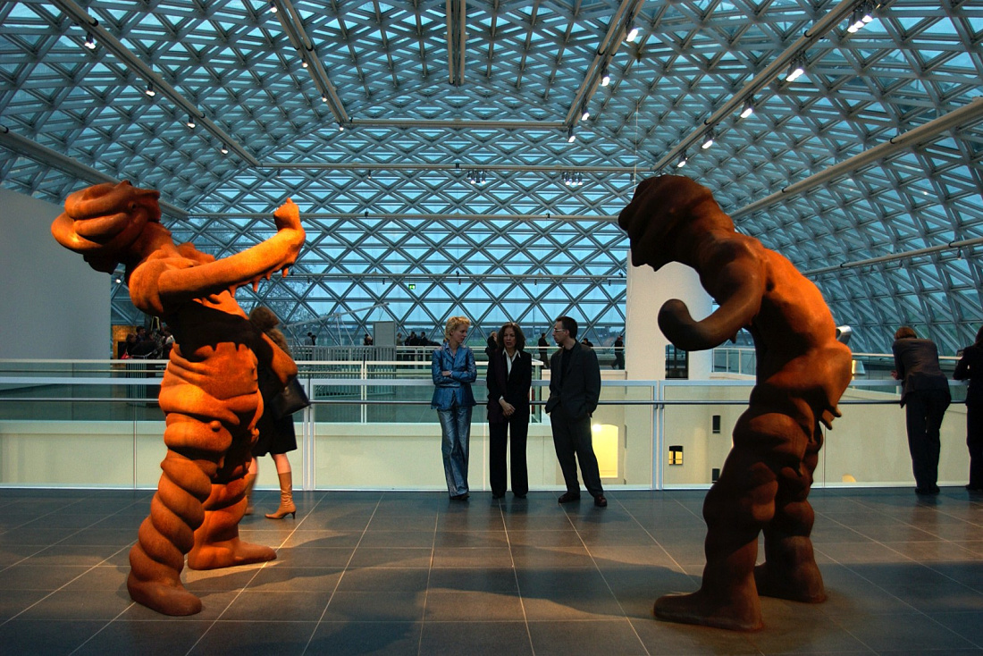 Sculptures at K21 Art Gallery in Dusseldorf under a transparent dome, illuminated by ERCO lighting.