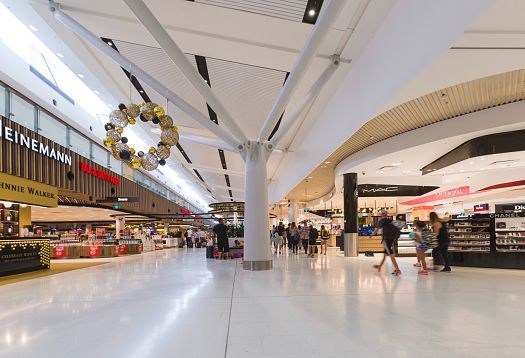 ERCO Skim downlights provide efficient, glare-free ambient lighting in Sydney Airports Terminal 1.