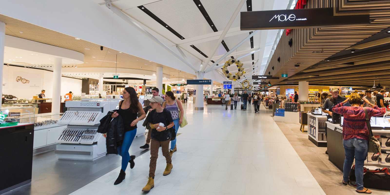 Sydney Airport Terminal 1 illuminated by efficient, glare-free ERCO Skim downlights.