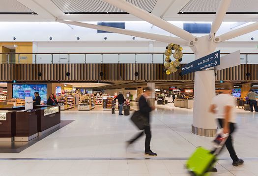 Sydney Airport Terminal 1 illuminated by efficient ERCO Skim downlights.