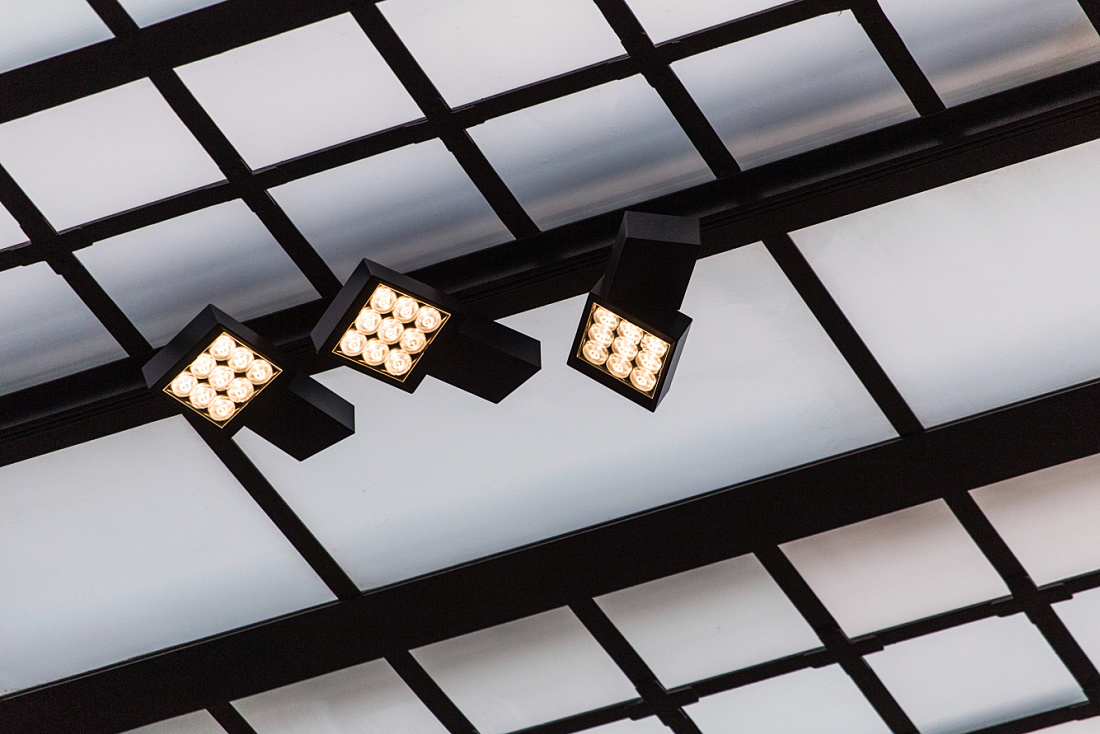 ERCO Opton LED spotlights on a ceiling in the Kiton store, Milan.