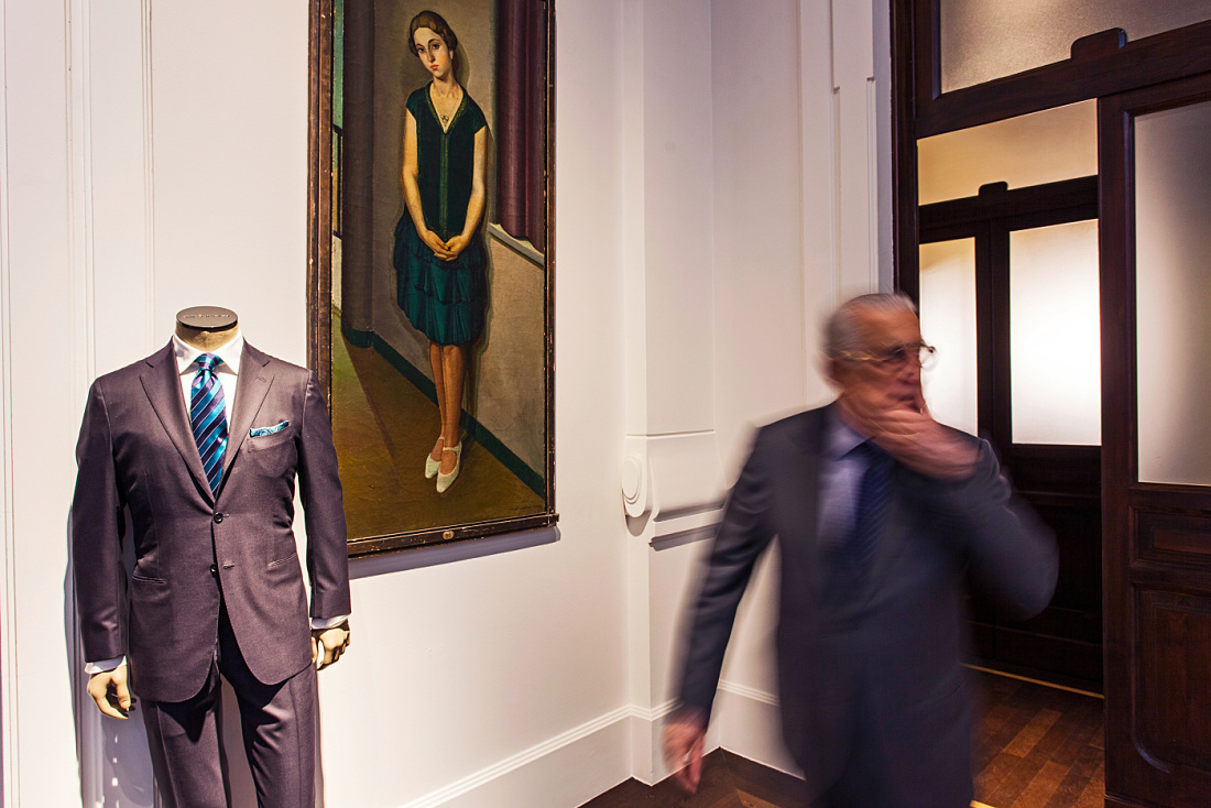 Kiton menswear suit in Milan store, illuminated by ERCO LED spotlights for high-end fashion accent lighting.
