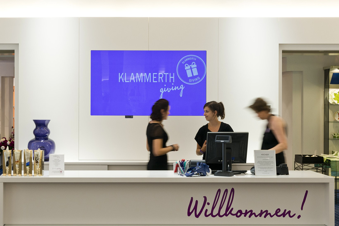 Klammerth store in Graz: Tableware illuminated by LED lighting in a UNESCO site.