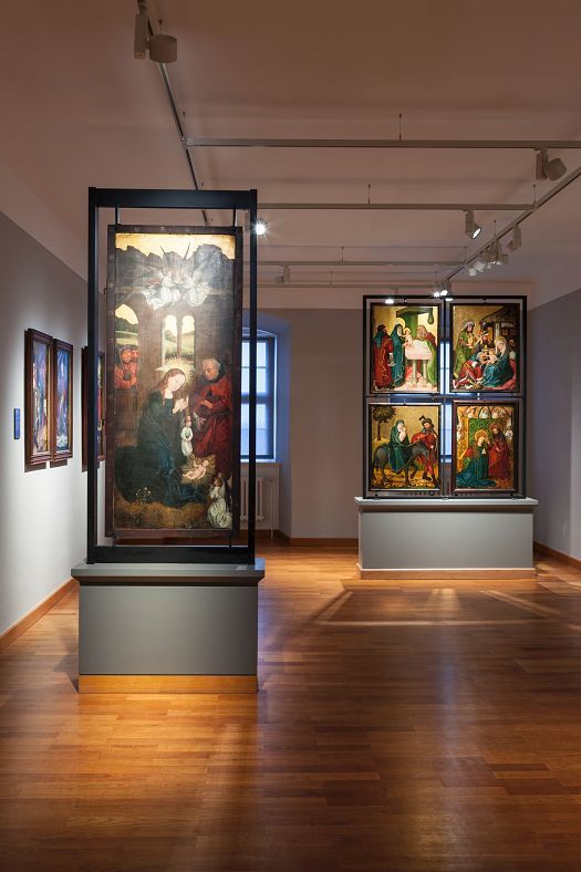 LED-lit paintings in Kronachs Franconian Gallery, featuring works by Lucas Cranach the Elder.