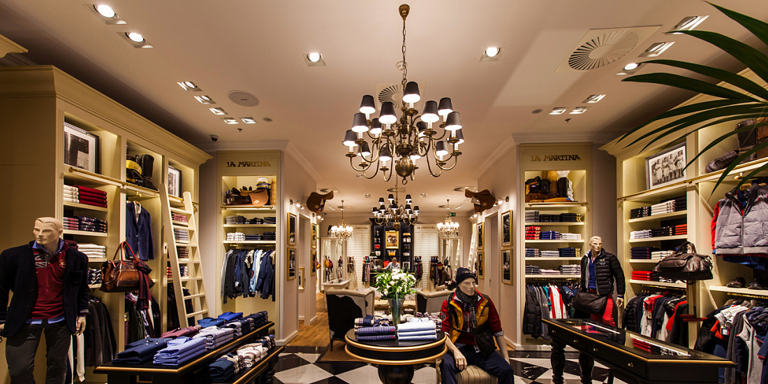 Interior of La Martina boutique in Prague, illuminated by ERCO LED lighting.